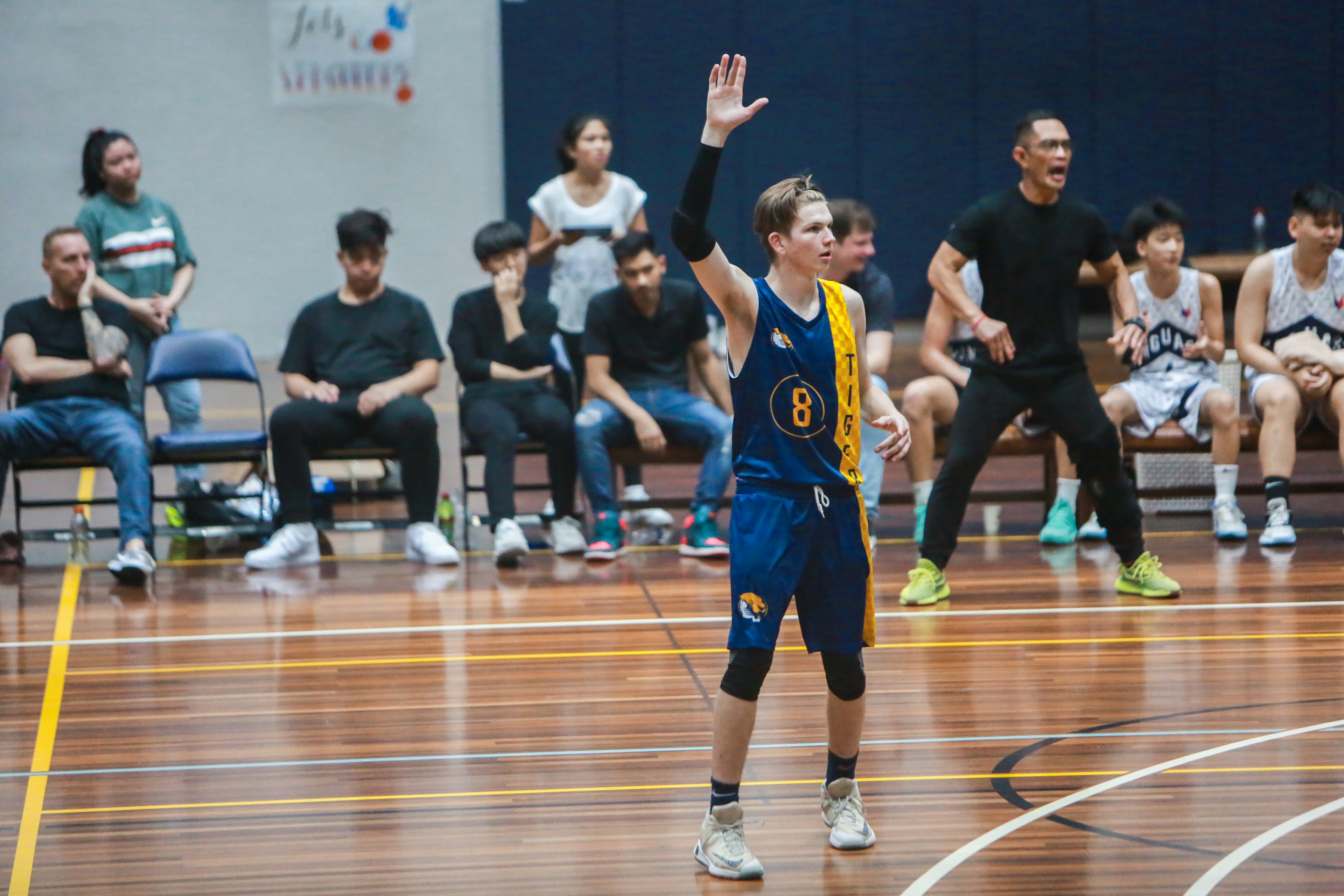 group of men playing basketball